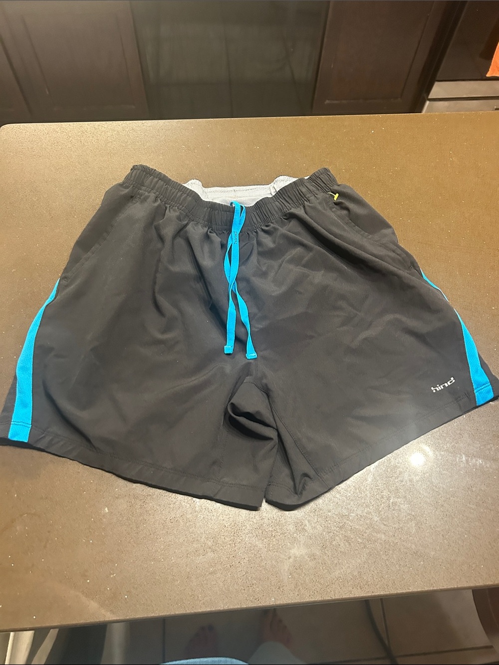 Hind Black Athletic Shorts with Bright Blue Accents